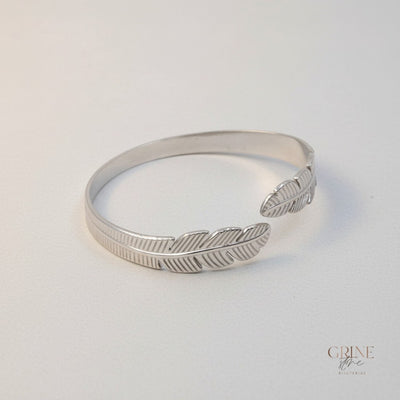 GRINE silver stainless steel cuff bracelet with delicate leaf design, adjustable and hypoallergenic.