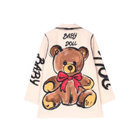 GRINE oversized beige blazer with a large teddy bear graphic and "BABY DOLL" text. Features a red bow.