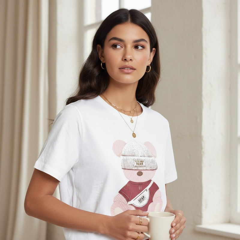 GRINE white cotton t-shirt with a graphic of a teddy bear wearing a beanie and a fanny pack.
