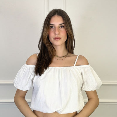 GRINE white cotton off-the-shoulder crop top with puff sleeves and a gathered neckline, worn by a model.