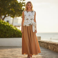 GRINE white 100% cotton sleeveless blouse with embroidered palm trees and a side tie detail. Perfect for summer.