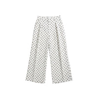 GRINE white pearl cotton trousers with black polka dot print, side slits, and button closure. Two pairs shown.