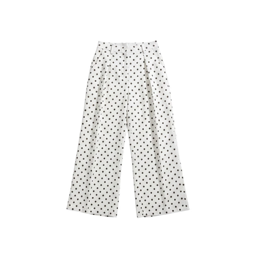 GRINE white pearl cotton trousers with black polka dot print, side slits, and button closure. Two pairs shown.