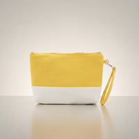 GRINE yellow and white canvas beach necessaire with removable wrist strap. Ideal for makeup and sunscreen.